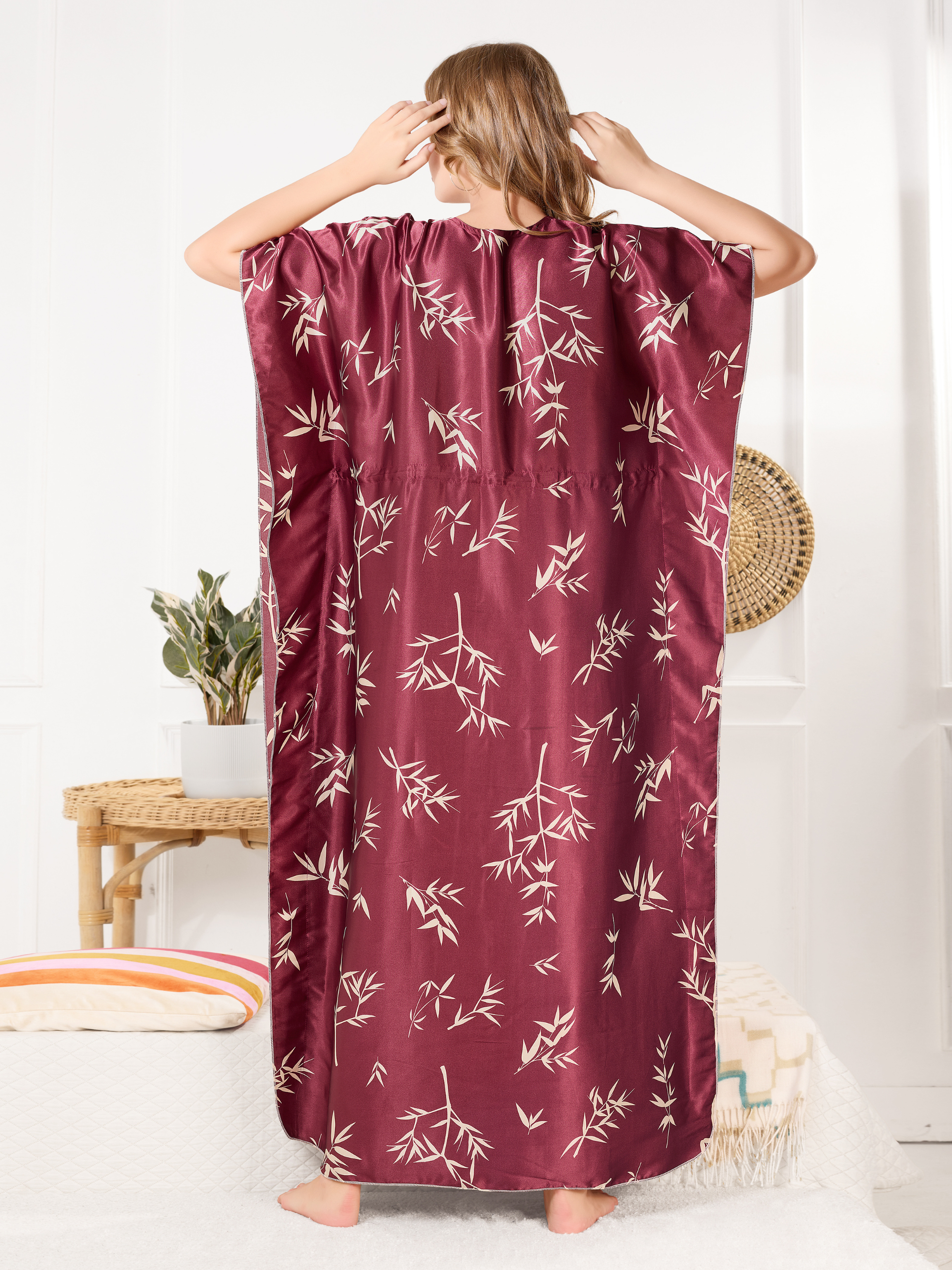 Flowy satin kaftan for women showing relaxed fit and leaf design from back