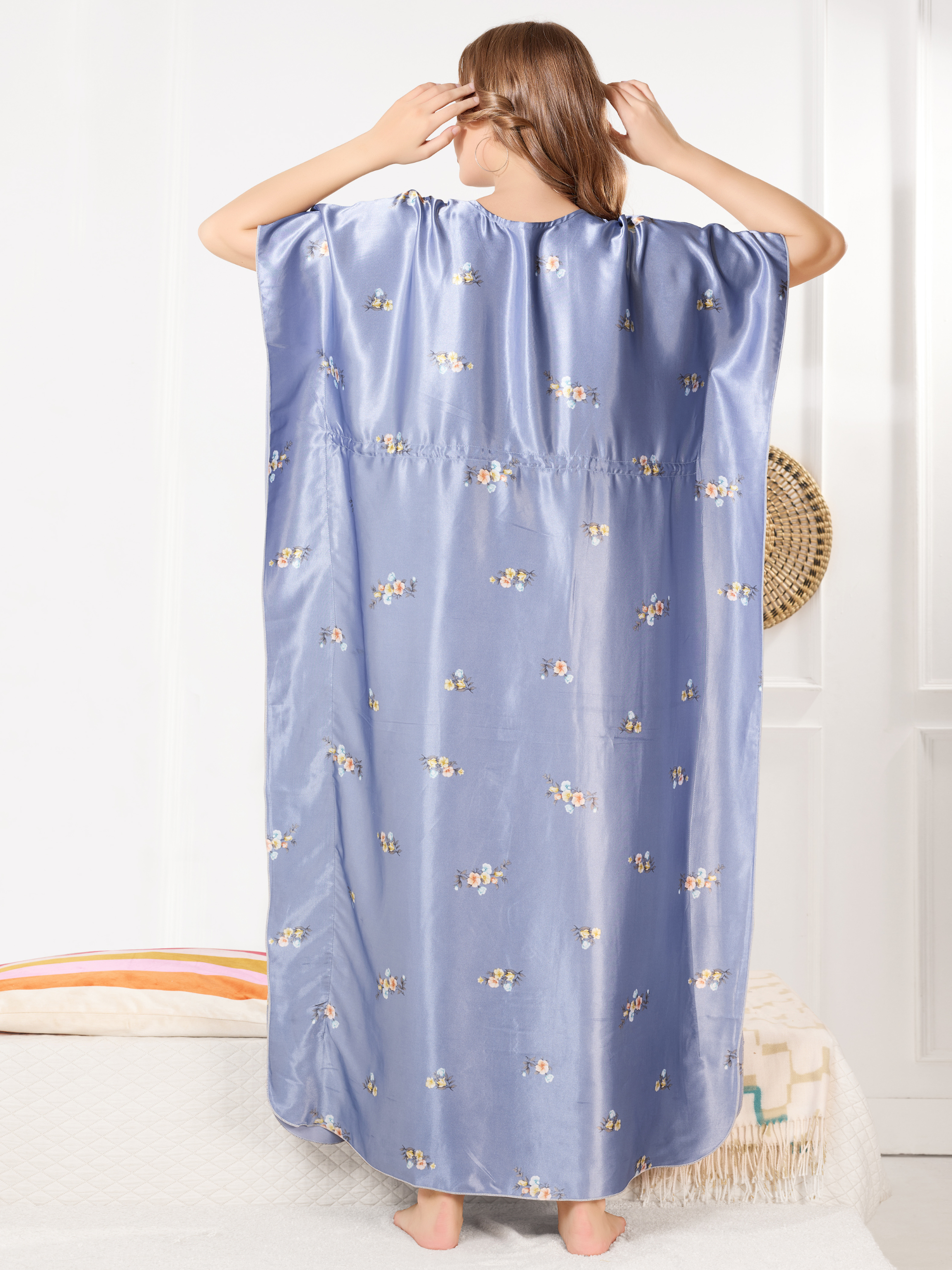 Flowy satin kaftan for women showing relaxed fit and floral design from back